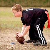 kid playing flag football